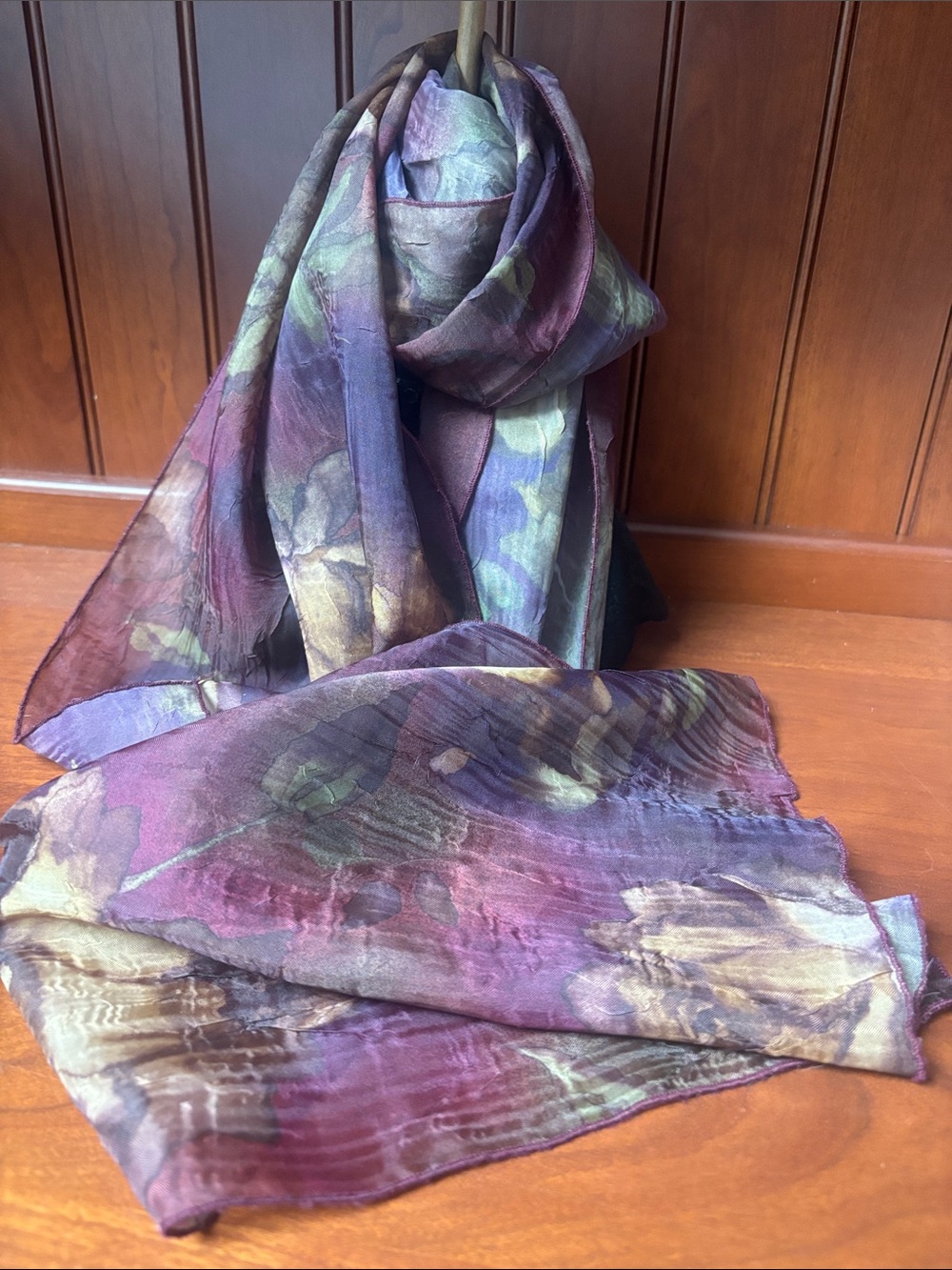 semi-translucent scarf with deep burgundy, plum, and warm gold floral details
